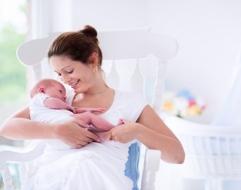 stock-photo-young-mother-holding-her-newborn-child-mom-nursing-baby-woman-and-new-born-boy-relax-in-a-white-314953310